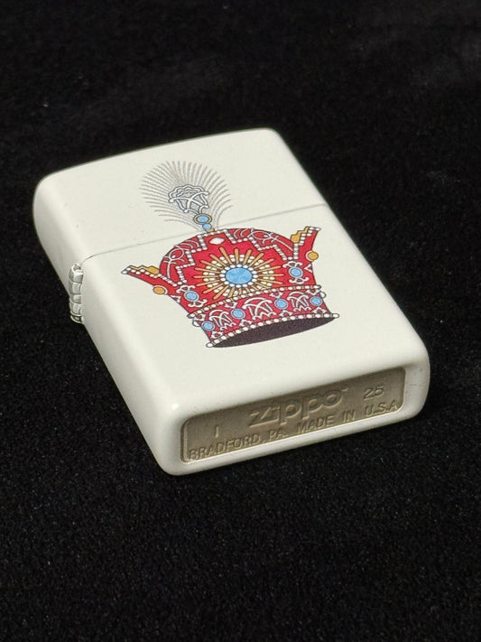 White lighter with red jeweled Pahlavi Crown design on black 