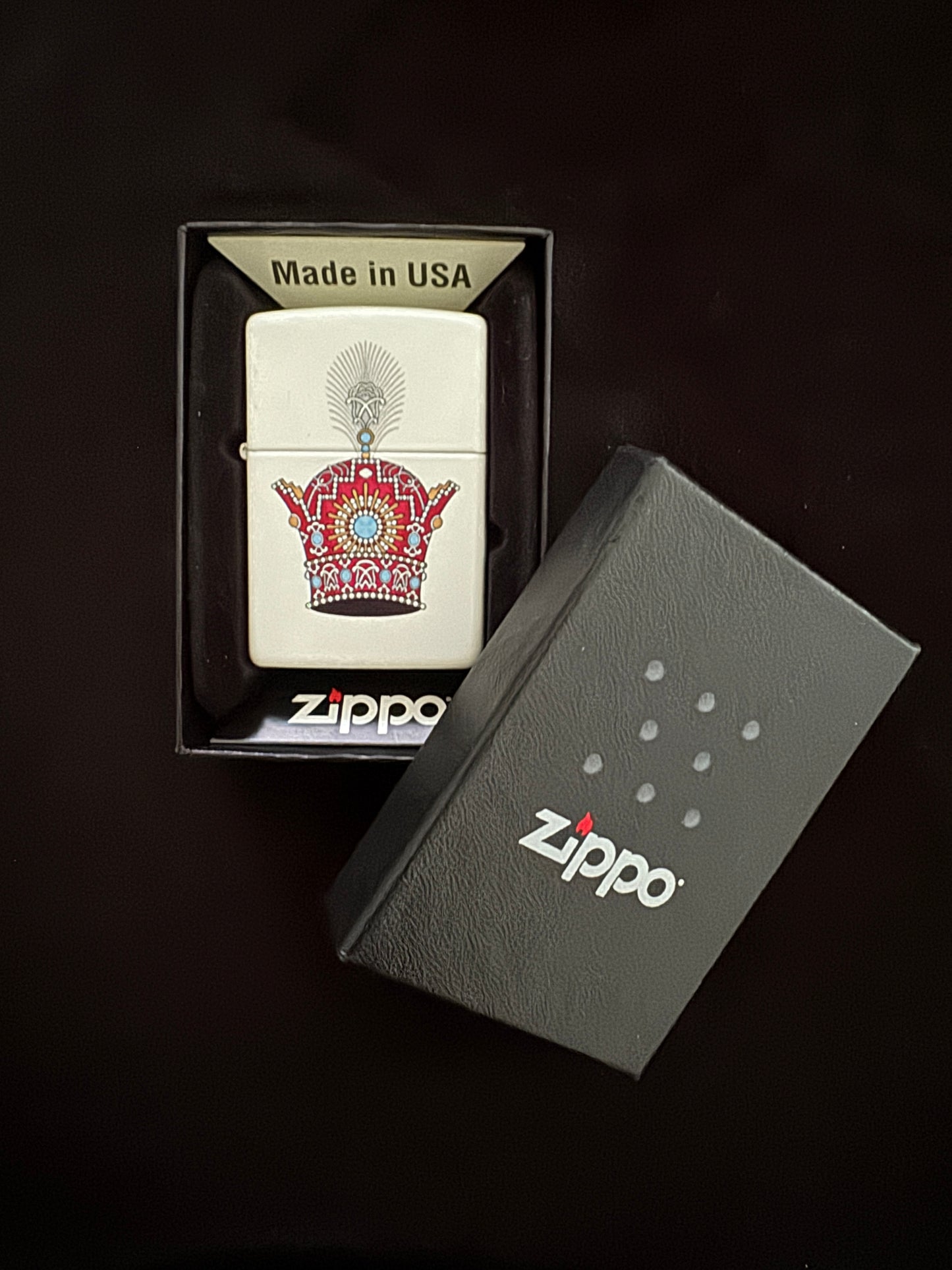 White lighter with red jeweled Pahlavi Crown design
